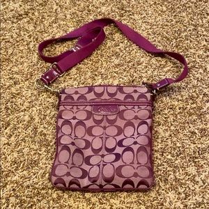 I am selling a purple crossbody coach purse!